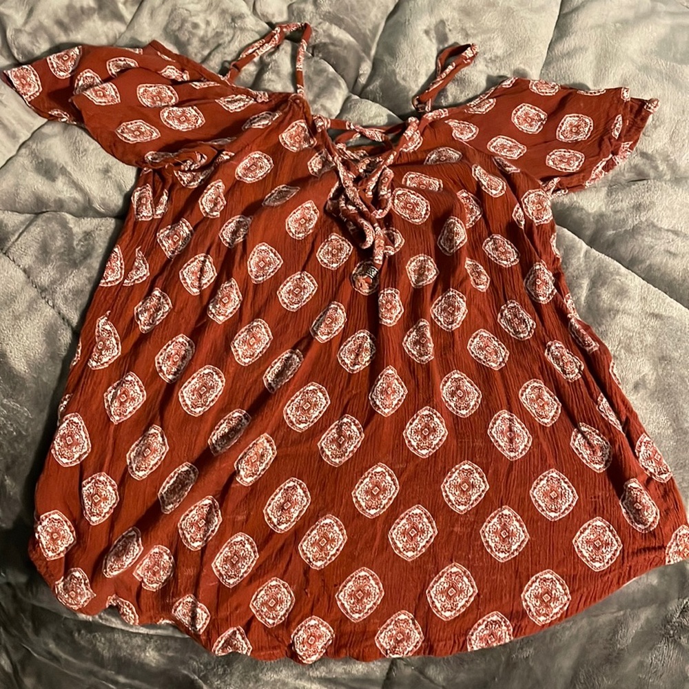 Reddish-orange blouse